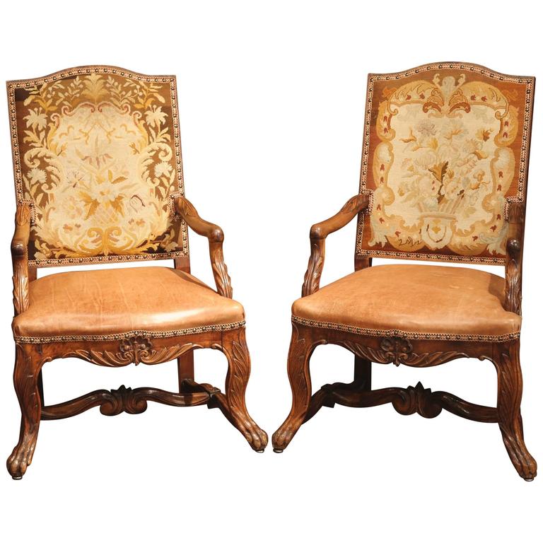 Pair of Louis XV style French armchairs with original needlepoint.