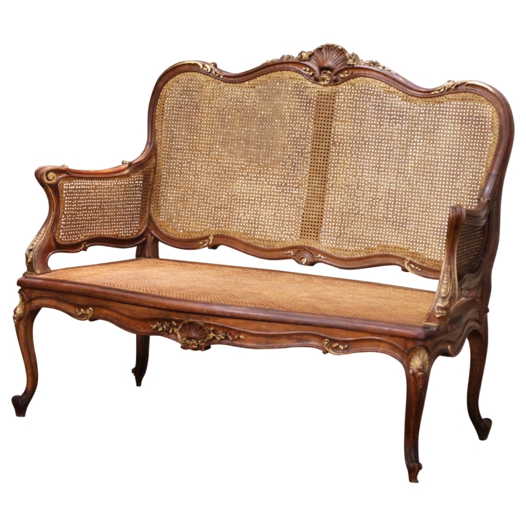 Early 20th C. French Louis XV Style Walnut and Cane Settee with Parcel Gilt